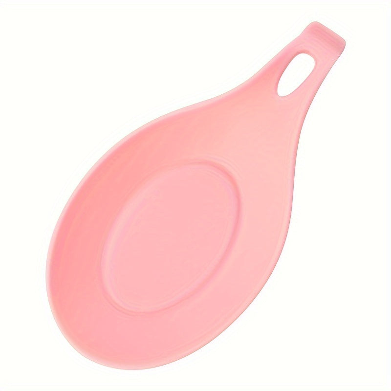 Durable, non-slip silicone spoon pad for kitchen utensils, heat-resistant and easy to clean.