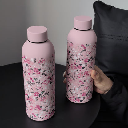 Stylish 16.9oz insulated water bottle with chic pink floral design, perfect for travel, sports, and everyday use. Great gift for birthdays and holidays.