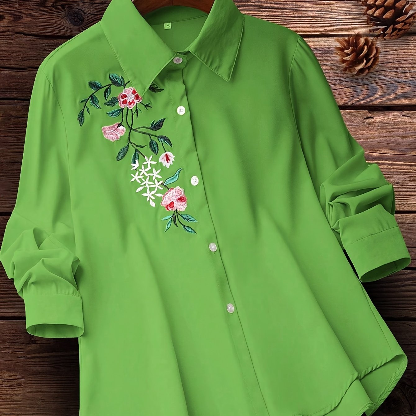 Embroidered floral button-up shirt for women, perfect for spring and fall.