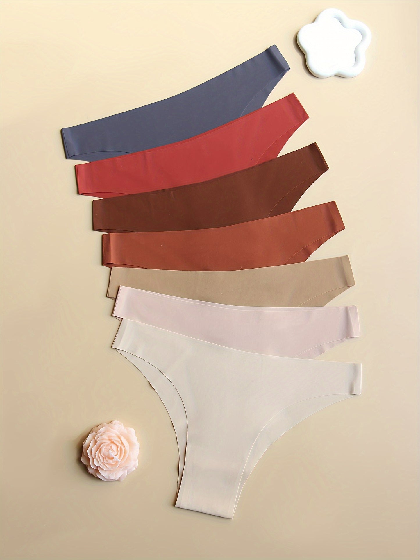 7-pack of seamless low-rise women's panties in solid colors. Stretchy, no-track, comfortable, breathable, and soft. Simple style.