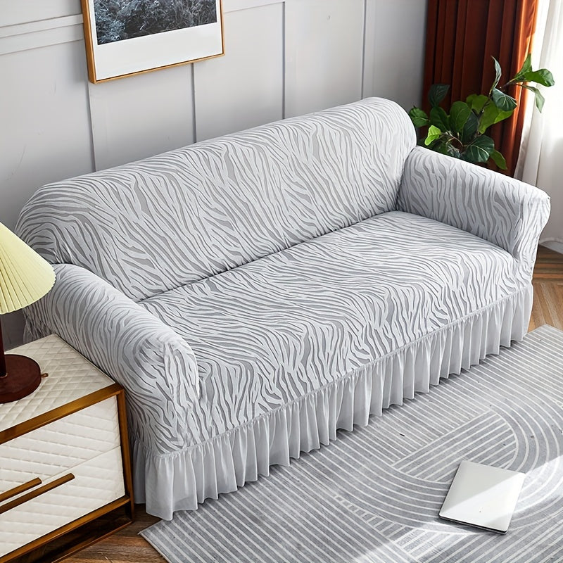 Wave pattern sofa slipcover with skirt, non-slip and dustproof. Protects furniture from cat scratches. Machine washable for easy cleaning. Suitable for bedroom, office, or living room décor.