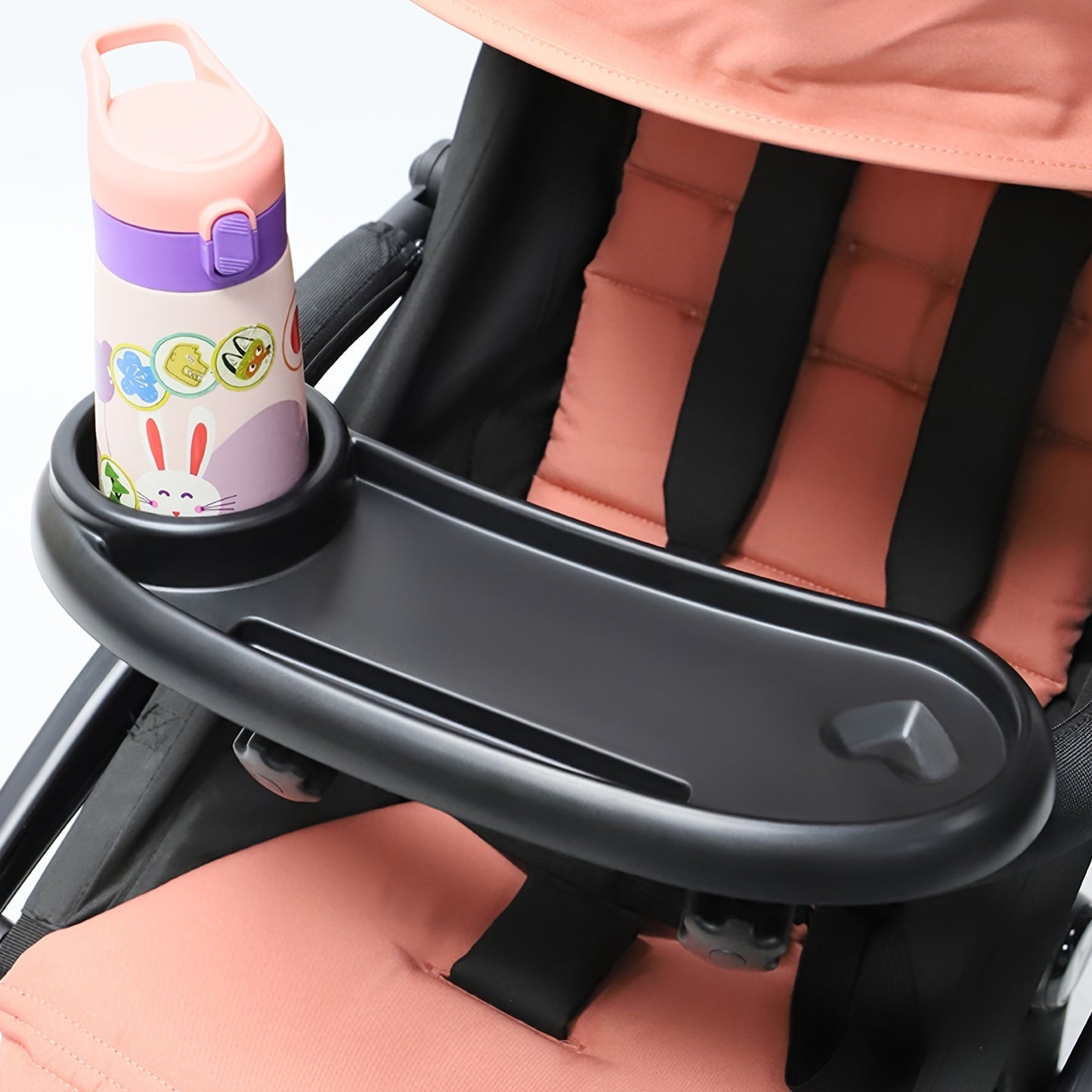 Get the ultimate stroller accessory with the 1-Pack Large Capacity Anti-Slip Stroller Tray. This portable armrest support tray comes with a convenient phone holder and is perfect for all your stroller needs. Made from durable ABS material, this tray is