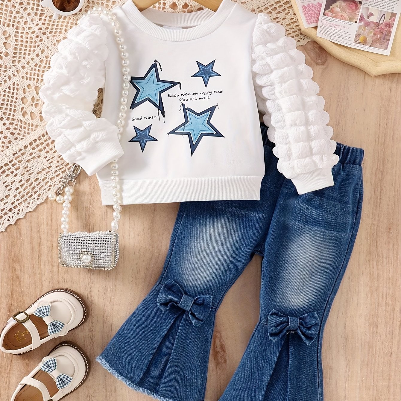 Girls' 2 piece outfit set with cartoon star and letter print puff sleeve top, bowknot, and bell bottom jeans - Ideal for Spring/Fall and outdoor activities.