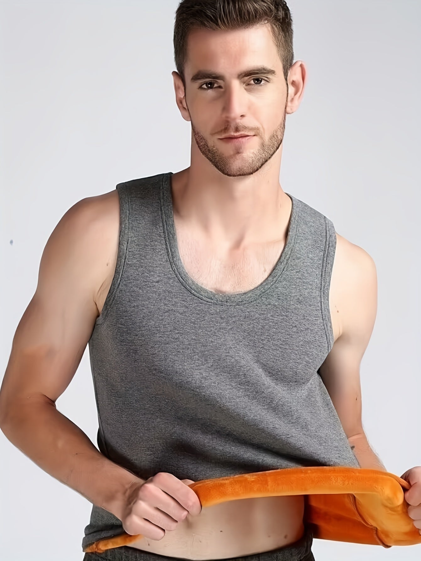 Men's windproof, slim fit thermal tank top for outdoor activities in fall/winter.