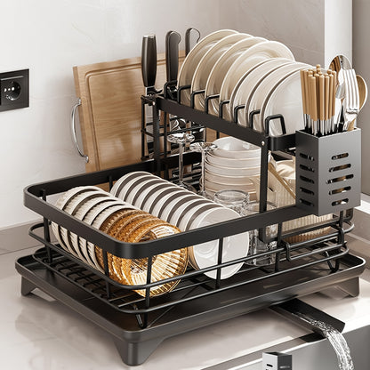 Black iron 2-tier kitchen dish rack with drainboard, utensil holder, cup hooks, and foldable design for space saving. Ideal for drying plates, bowls, pots, and cutlery.