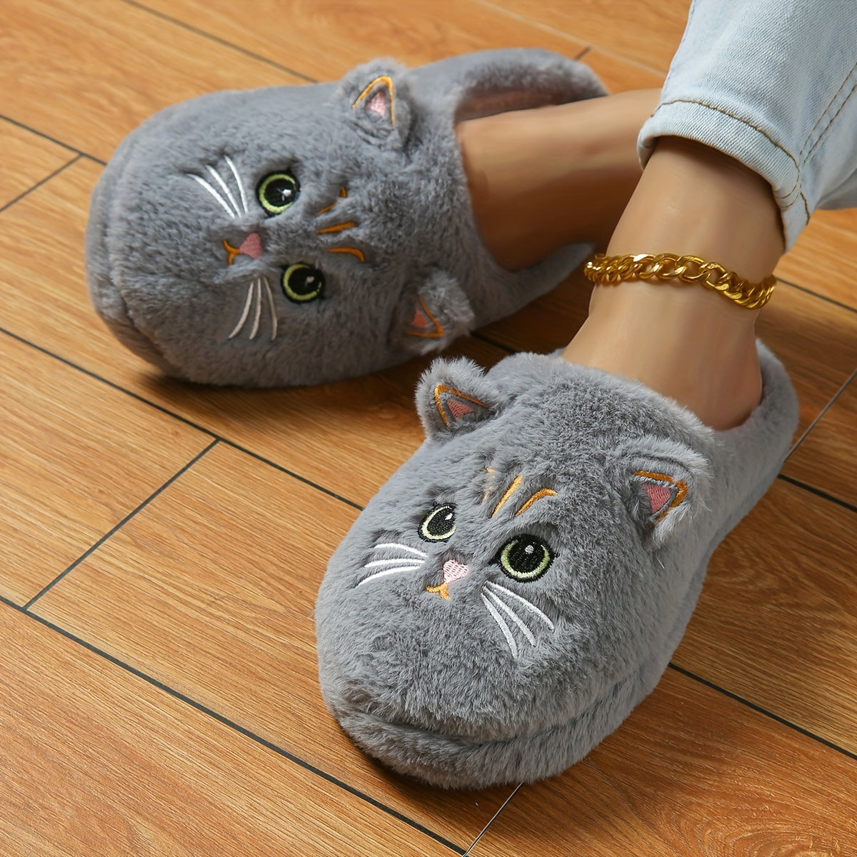 Women's cute cartoon black cat slippers with big eyes and ears, soft, warm, non-slip indoor house slip-ons made of fabric with TPR soles.