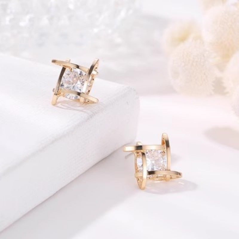 These elegant and luxurious S925 sterling silver post earrings feature synthetic cubic zirconia in an irregular shape, making them a stylish choice for women's fashion jewelry. Perfect for everyday wear or as a special gift, they are ideal for