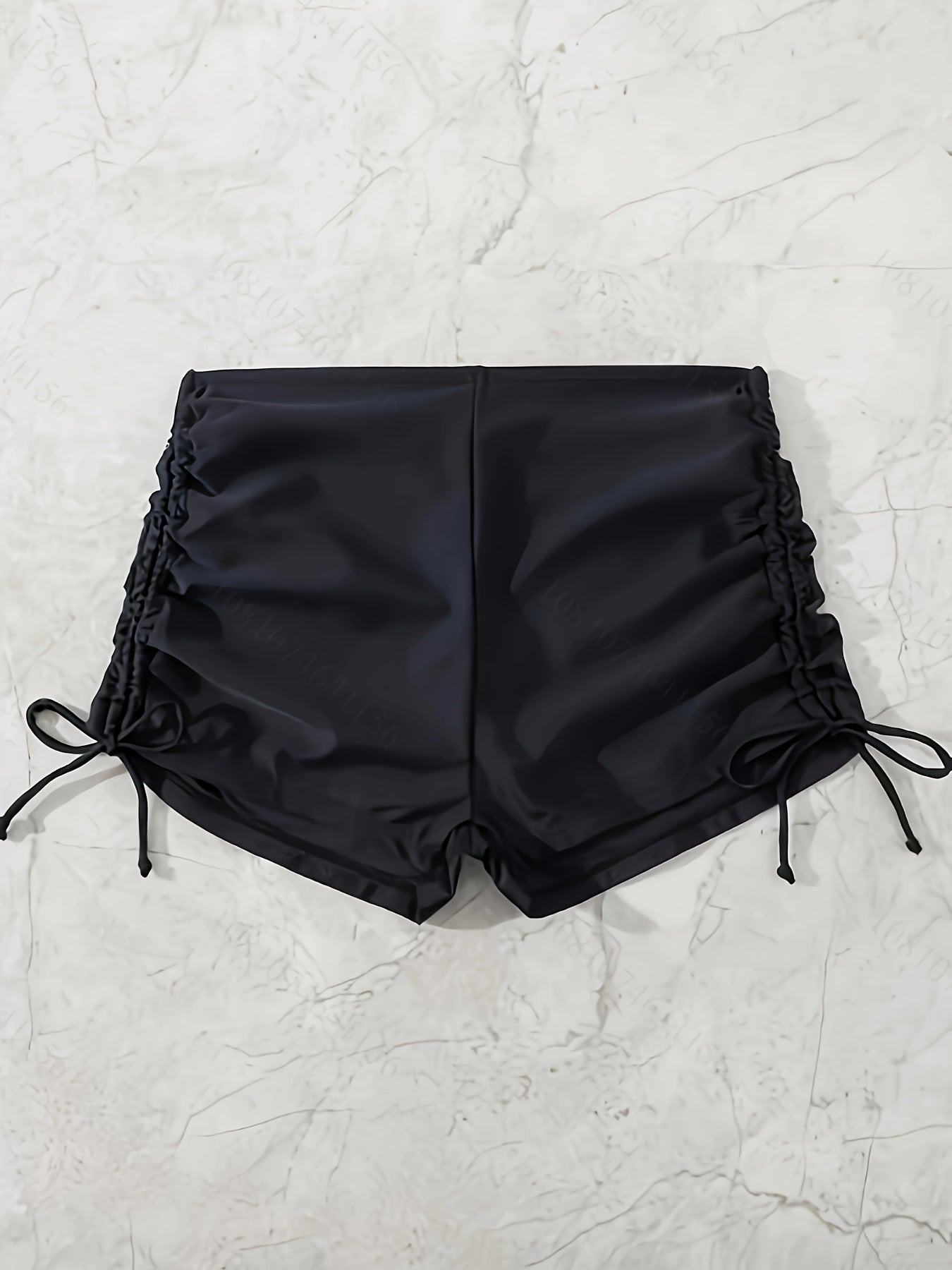 Black drawstring swim shorts for women.