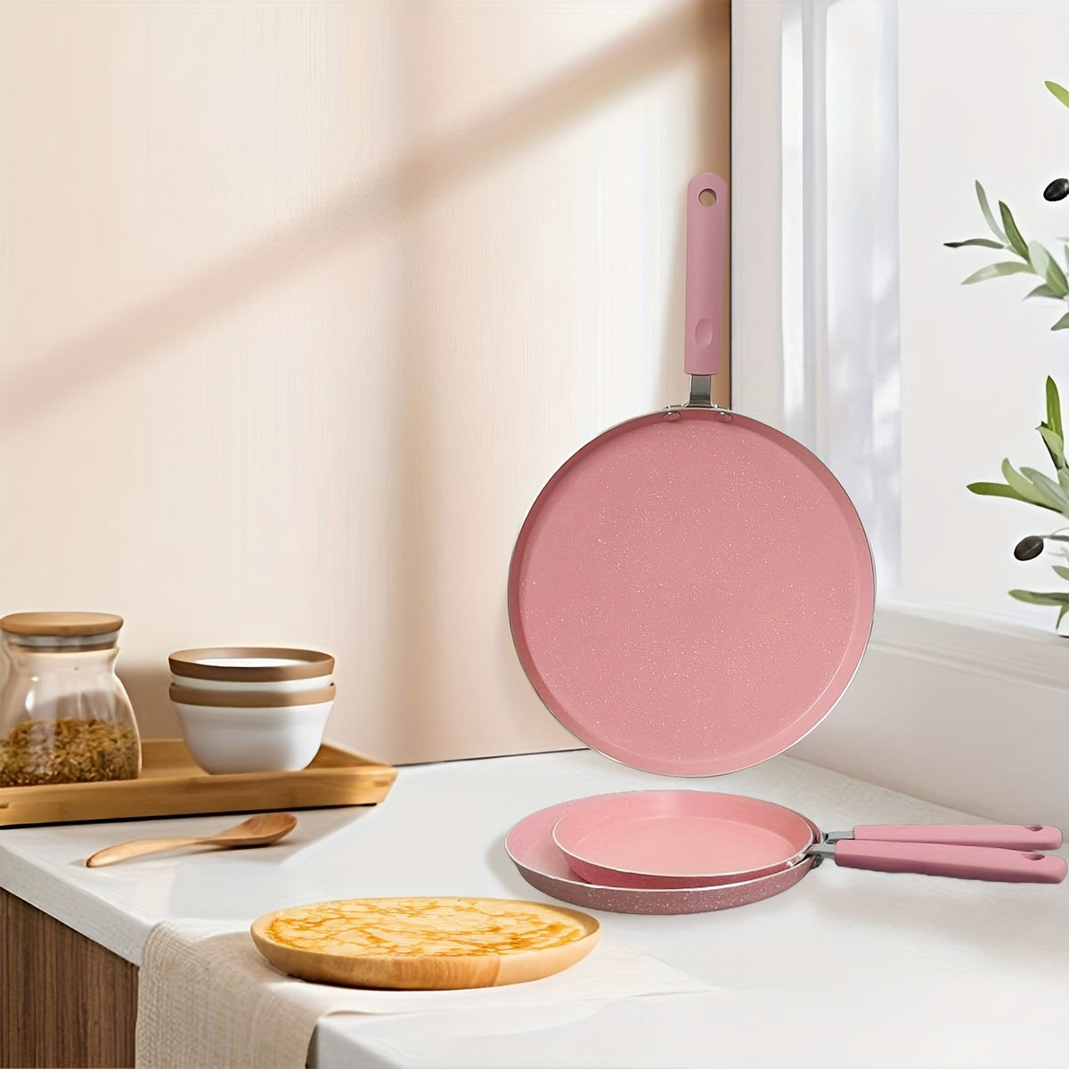 Non-stick aluminum frying pan with pink mica stone finish and wooden handle. Dishwasher safe and compatible with electric coil stoves. Perfect for cooking pancakes and eggs without the need for electricity.