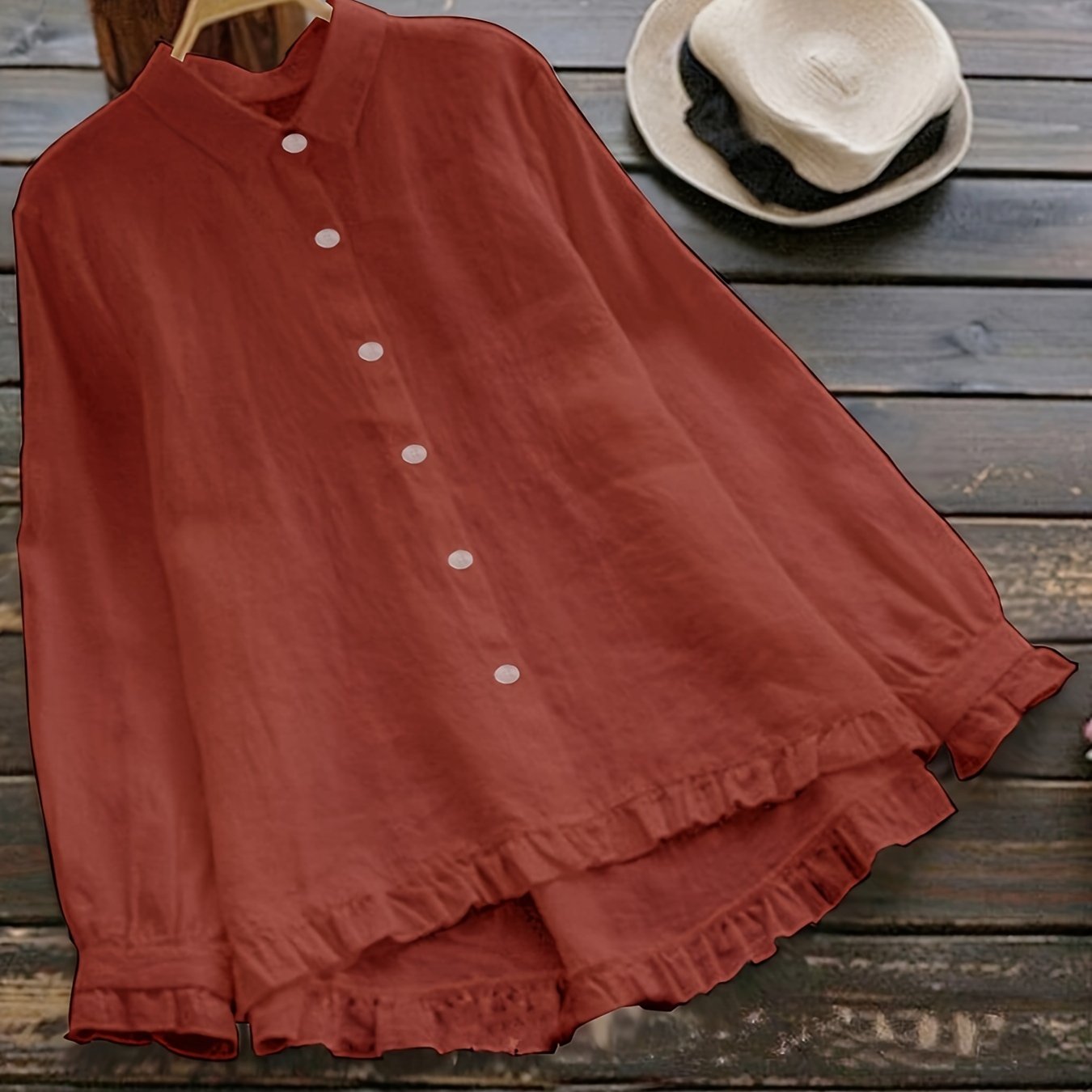 Loose-fitting collared shirt in solid color with front buttons and lace trim.