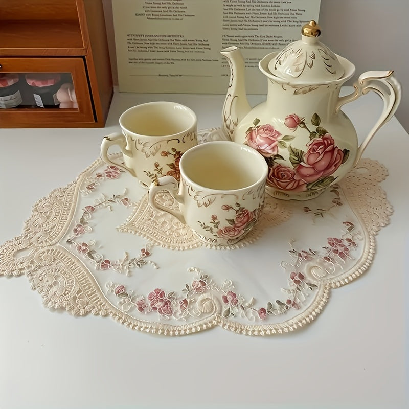 Vintage French lace embroidered placemat in polyester, ideal for dressing up tables or as a photography prop.