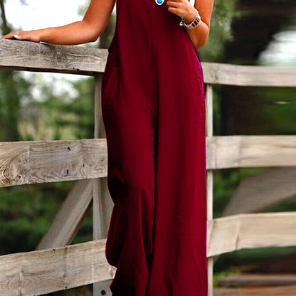 Wide leg jumpsuit with spaghetti straps, sleeveless with pockets, versatile women's clothing.