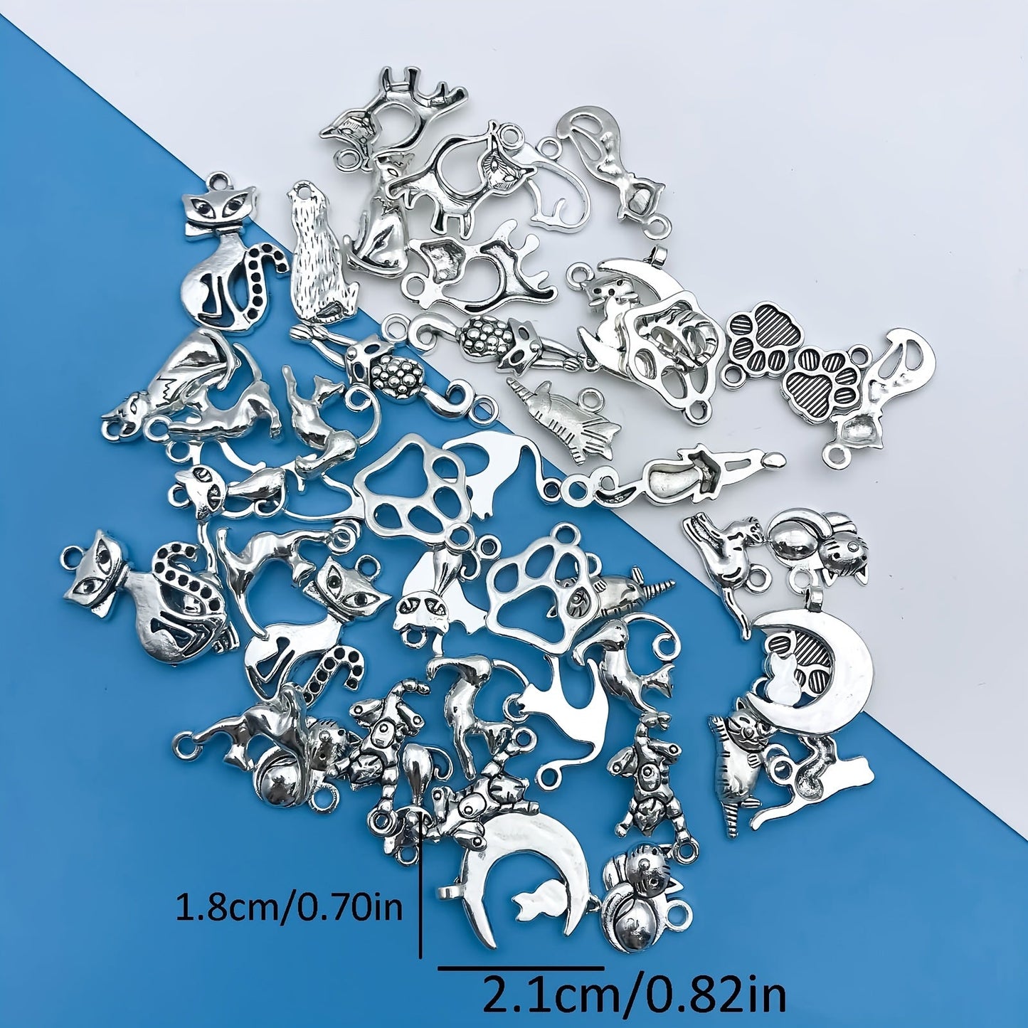 Create your own unique jewelry pieces with this set of 51 zinc alloy antique silvery animal series cat-shaped charms pendants. Perfect for DIY necklaces, bracelets, and earrings.