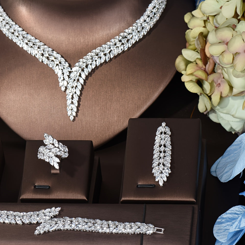 Elegant Leaf-Shaped Jewelry Set with Sparkling Zirconia, 18K Gold Plated Copper. Includes Earrings, Necklace, Bracelet, and Ring. Perfect for Weddings, Parties, and Bridal Wear.