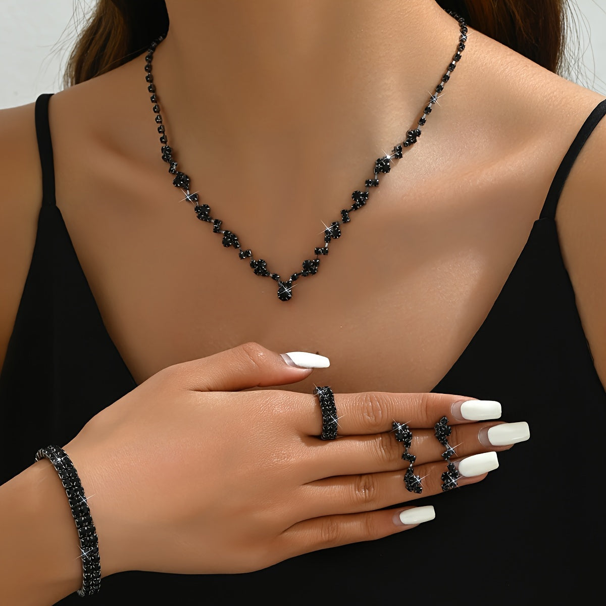 Modern European and American jewelry set with necklace, bracelet, earrings, and ring in gold, silver, and black. Ideal for women as versatile accessories, especially for weddings.