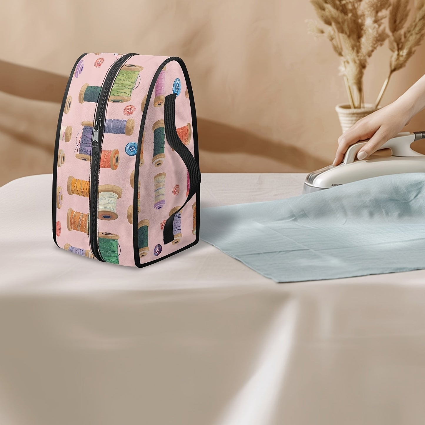 A convenient Portable Ironing Bag with a Stylish Textile Design, complete with a Top Handle and Double Zippers. Perfect for keeping your clothes dust-free during travel or storage.