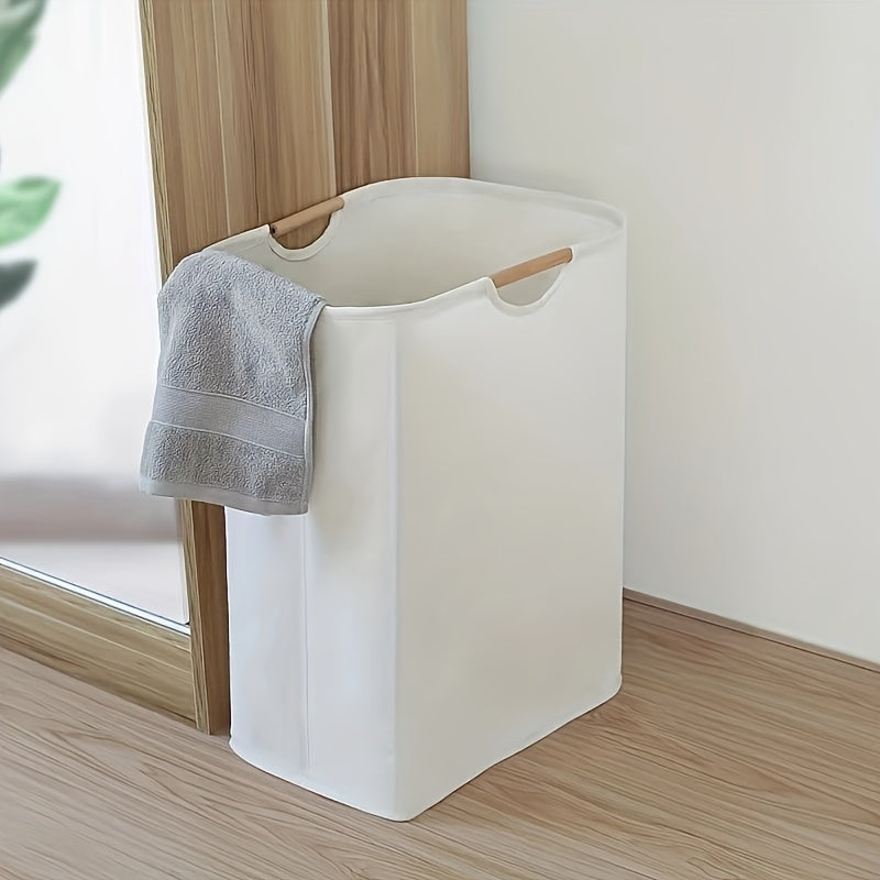 A foldable laundry basket that is perfect for storing dirty clothes, whether it be in the bathroom or in the laundry room. Made of fabric, this portable storage solution is both practical and stylish.