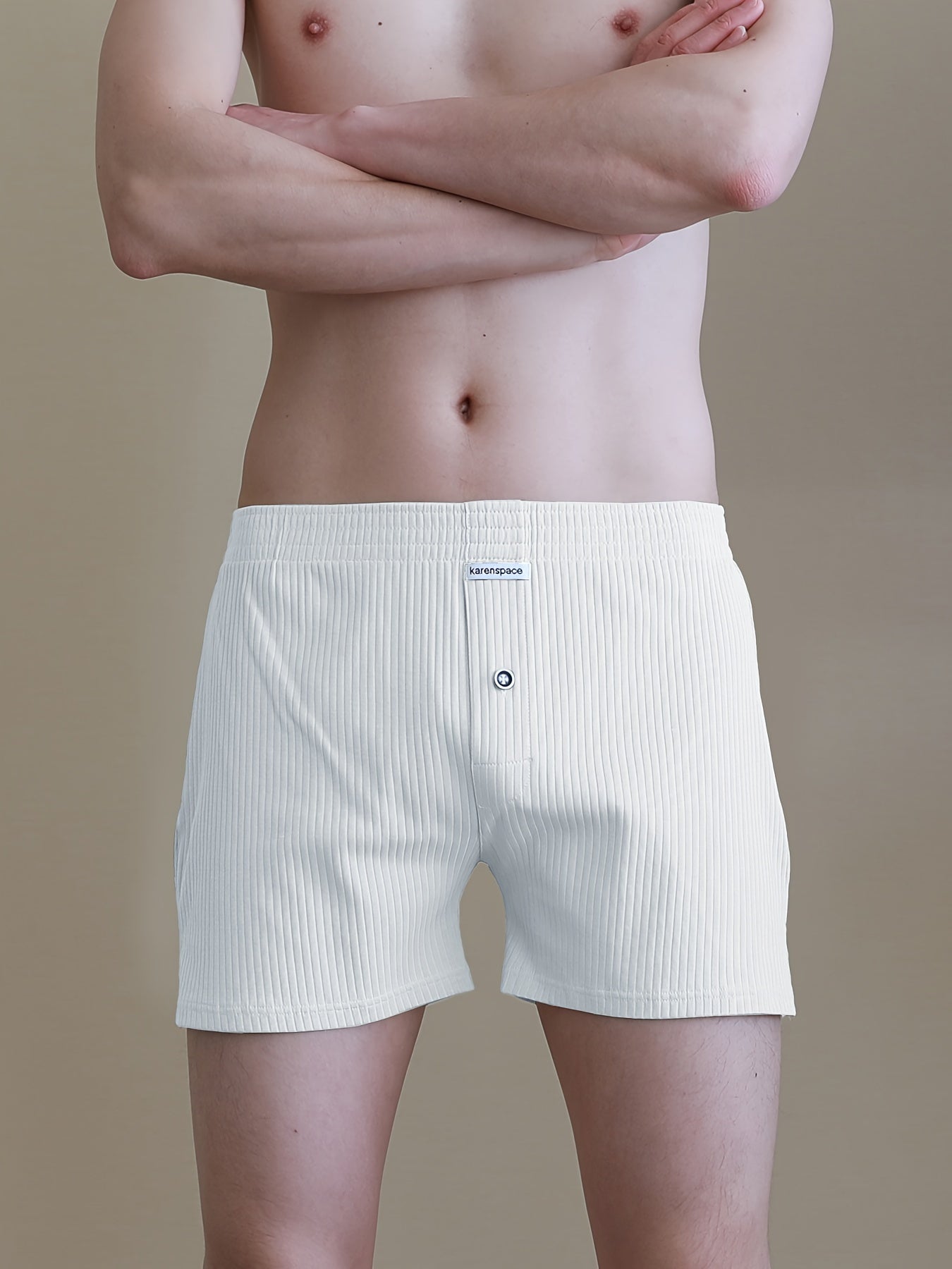 Cotton boxer shorts with button fly, loose fit and breathable for comfortable sleep and home wear.