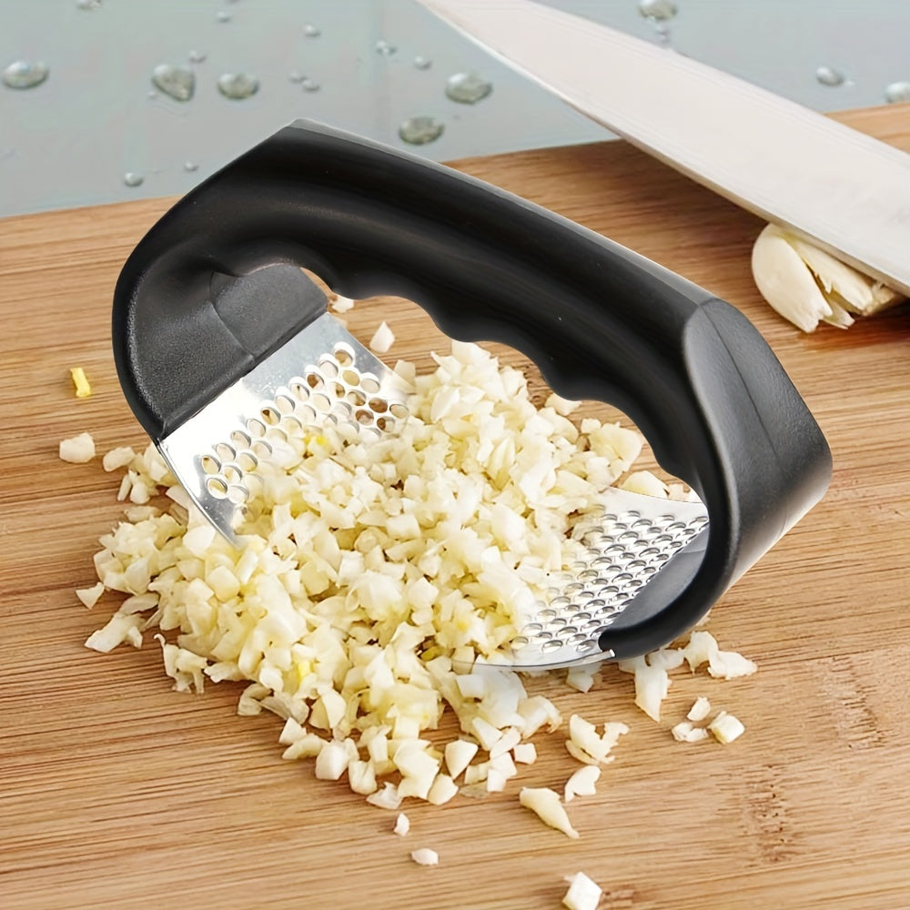 Durable stainless steel garlic press with ergonomic handle for easy manual use. Suitable for home and restaurant kitchens, no electricity needed.