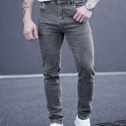 Men's slim-fit stretch denim jeans with casual straight leg and washed look, suitable for all seasons.