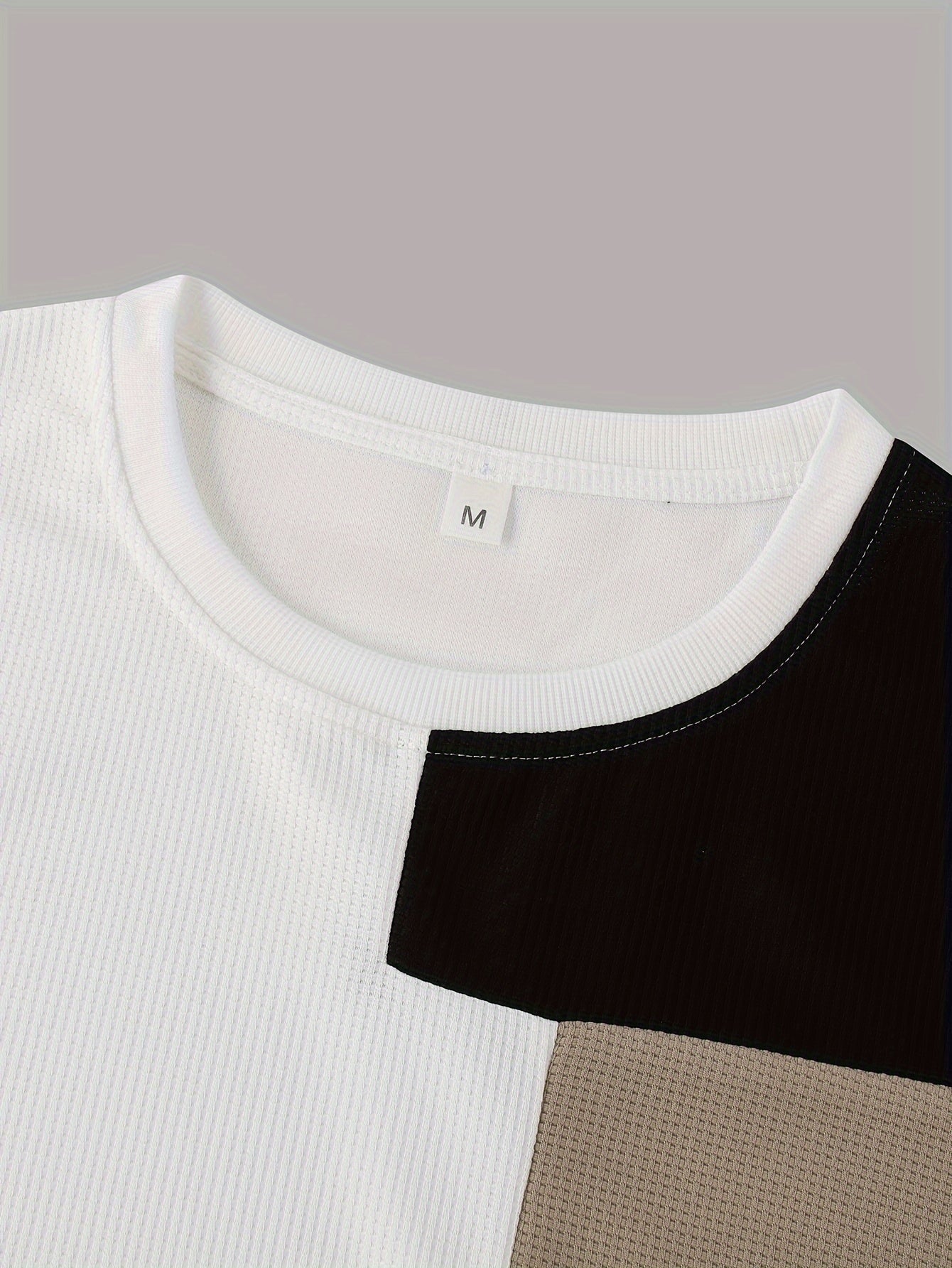 Quick-dry color block t-shirt with breathable polyester fabric and round neckline; machine washable.