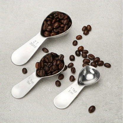 Coffee scoop made of stainless steel with measurement marks - ideal for measuring beans, powder, and baking ingredients.