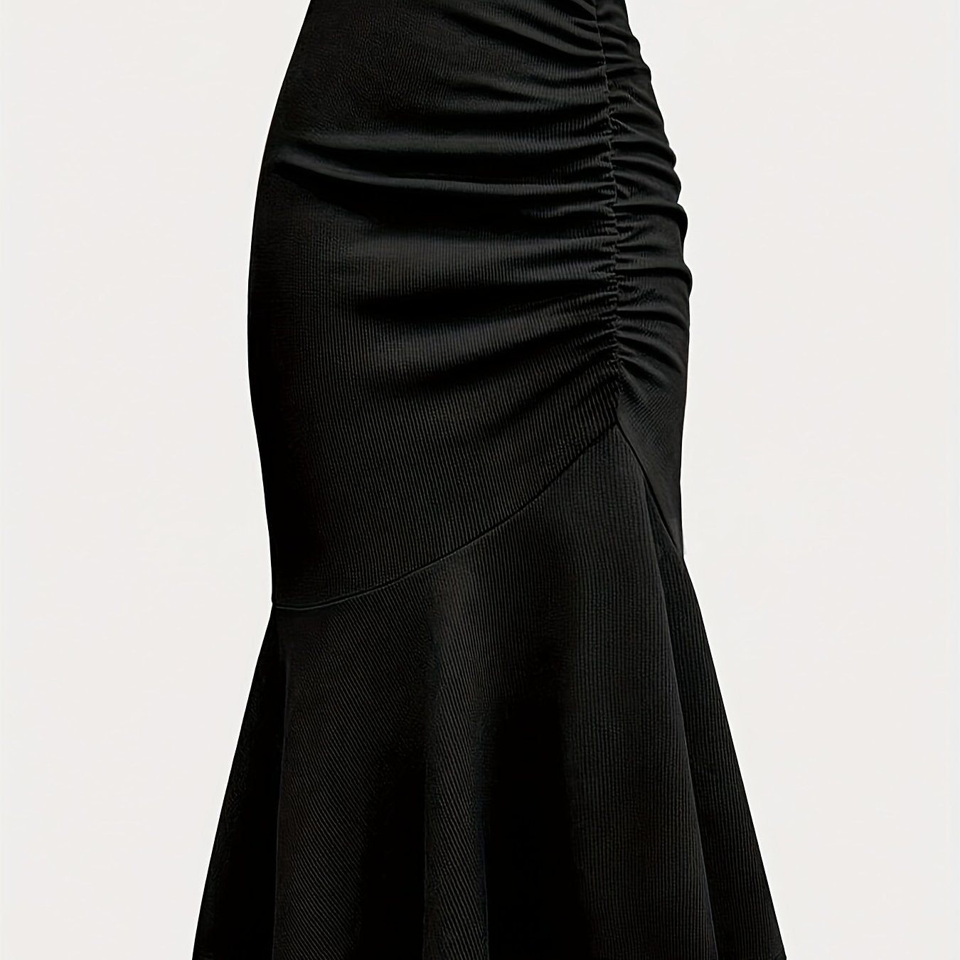 Elegant black mermaid skirt with ruffled hem for all occasions. Made of polyester knit fabric.