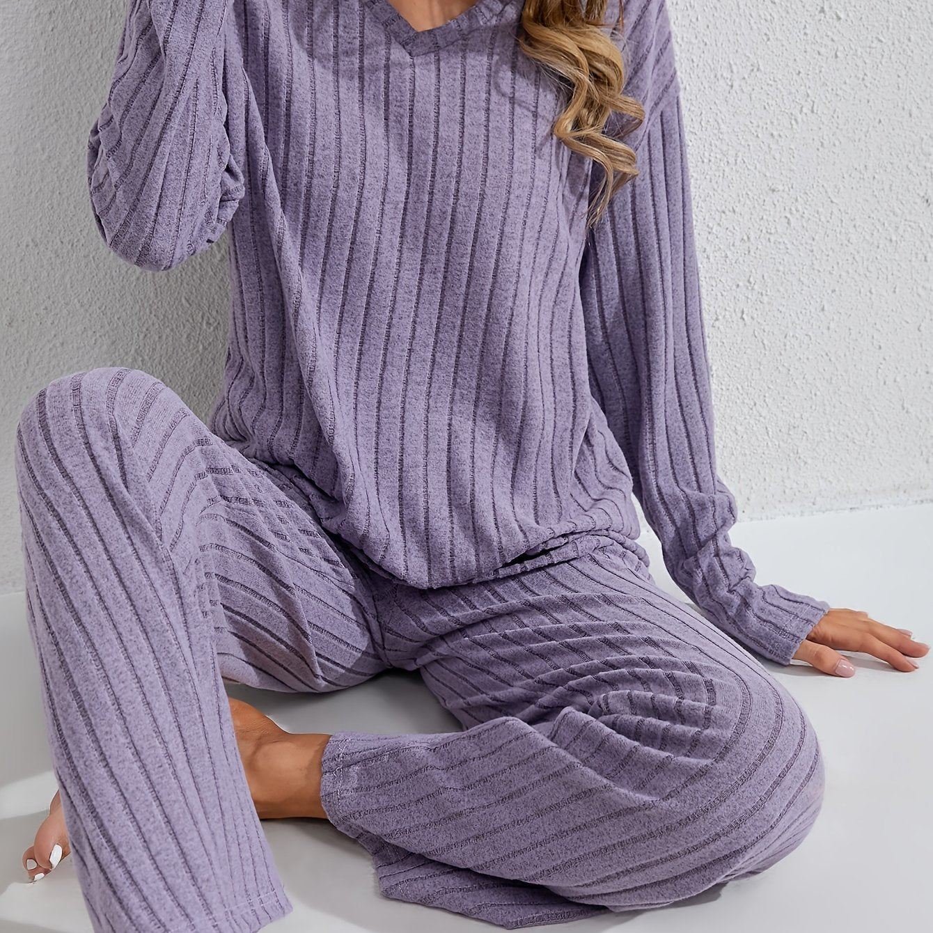 Women's cozy and stylish long sleeve top and pants set for autumn and winter.