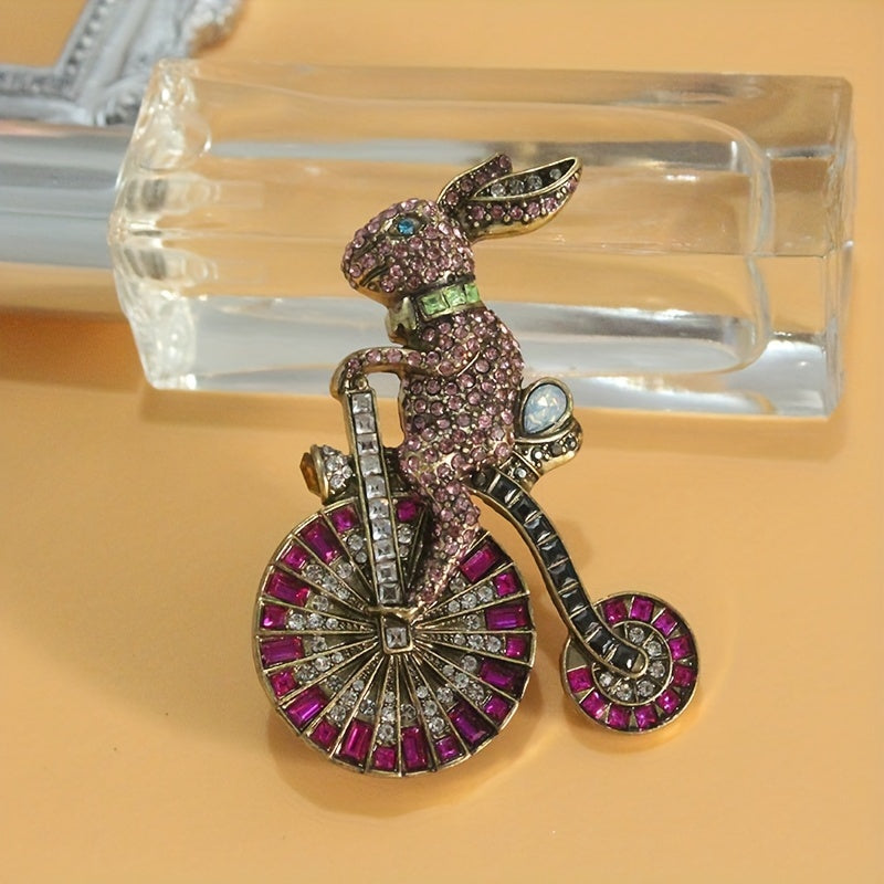 Add a touch of nostalgia with this adorable 1PC Retro Bunny Bicycle Shaped Brooch, embellished with rhinestones. A perfect accessory for women to add to their dress, coat, sweater, or corsage.