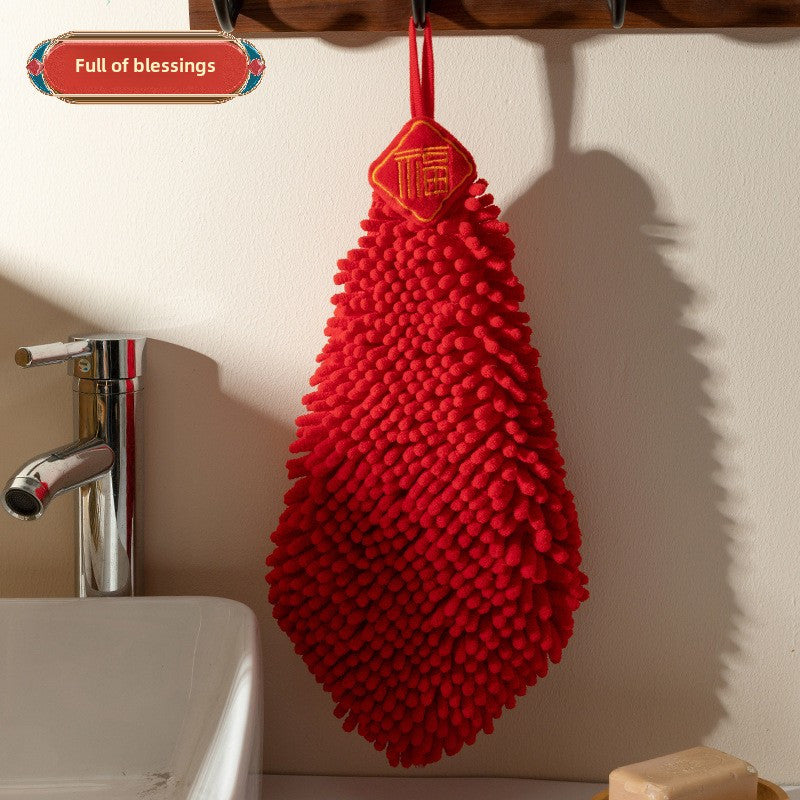 Red chenille hand towel for kitchen and bathroom décor with festive hanging design.