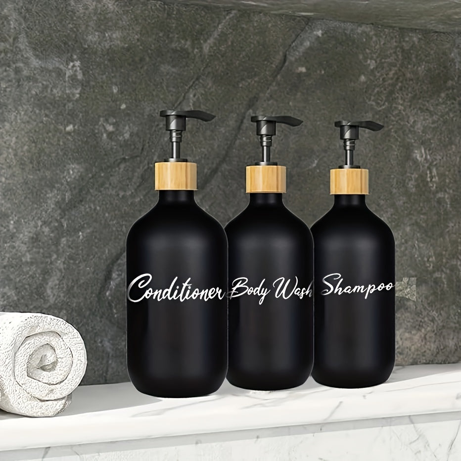 3 black soap dispensers for bathroom shower products, refillable liquid storage containers.