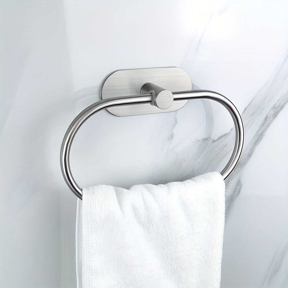 Self-adhesive stainless steel bathroom accessories for towel and dishcloth storage.