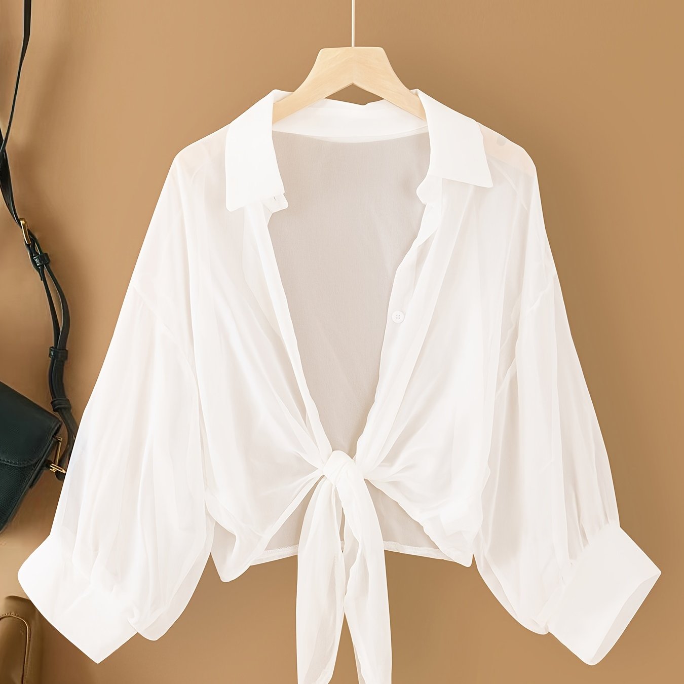 Women's casual chiffon cardigan with front bow detail and lapel collar, suitable for spring/summer/fall.