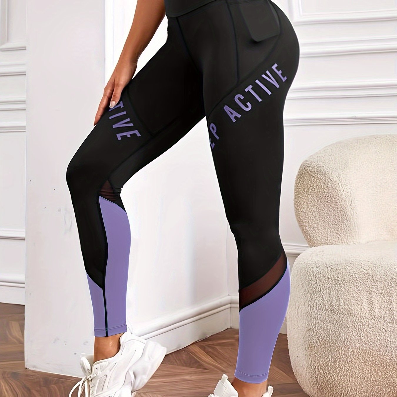 High waisted yoga leggings with pockets and color-block letter print for women's casual sports wear.