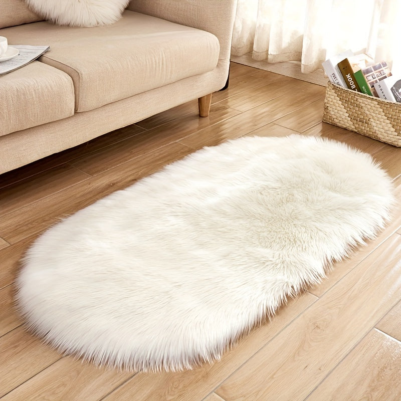 Soft and plush faux sheepskin oval area rug, perfect for adding a cozy touch to any living room or bedroom. Machine washable and designed to be used as a bedside rug. This shaggy plush carpet will enhance your home decor and add a touch of luxury to any