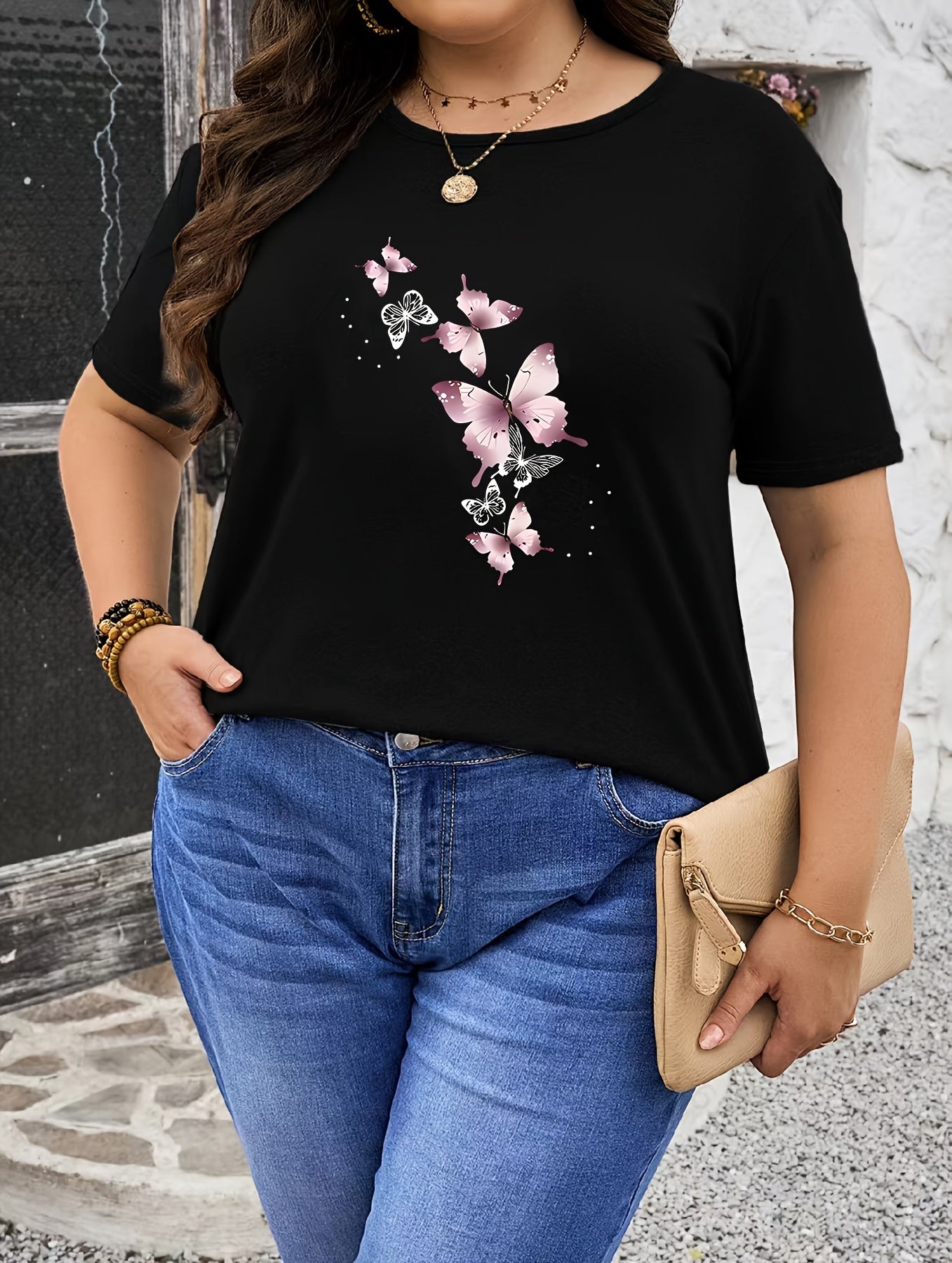 Stylish plus size pink butterfly print t-shirt for women, crew neck, short sleeve, stretchy polyester blend, machine washable. Ideal for spring/summer.