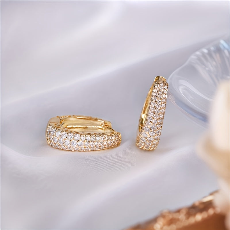 Vintage-style golden hoop earrings with sparking zirconia inlays, crafted from copper material, make a sophisticated and elegant gift for women.