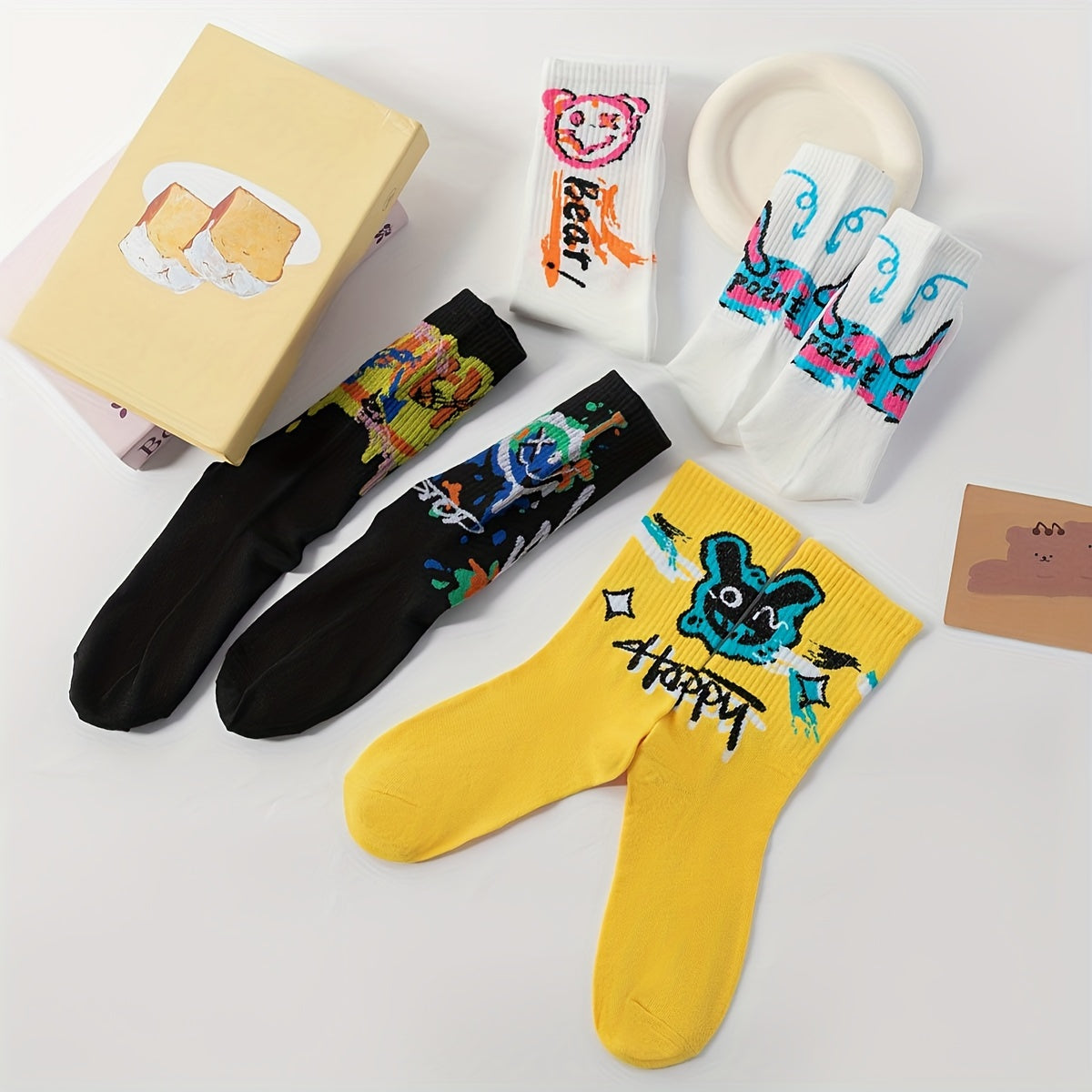 10 Pairs Men's Mid-Calf Socks - Stylish graffiti design, perfect for daily wear and outdoor activities. Made of a blend of polyester and spandex.