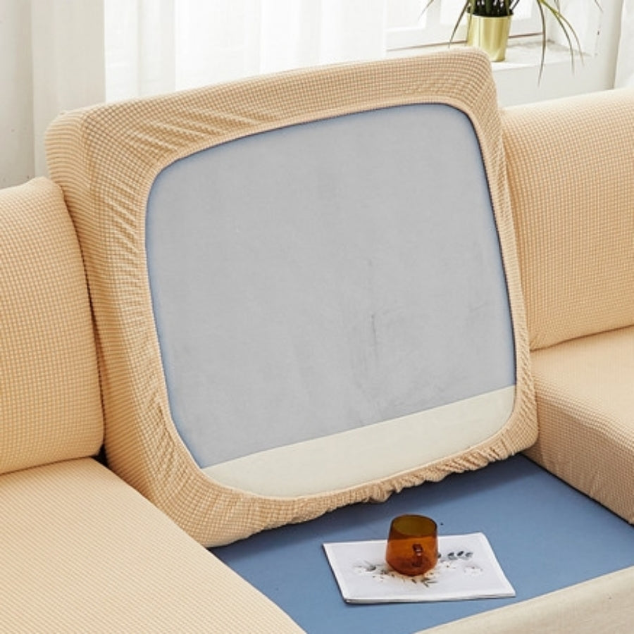 Durable sofa cover protects furniture from spills and stains.