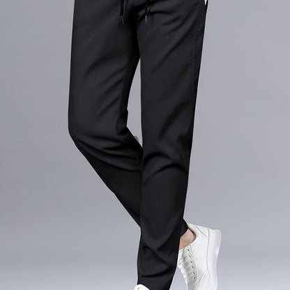 Stylish men's solid pants with pockets, casual and breathable drawstring trousers for outdoor activities.