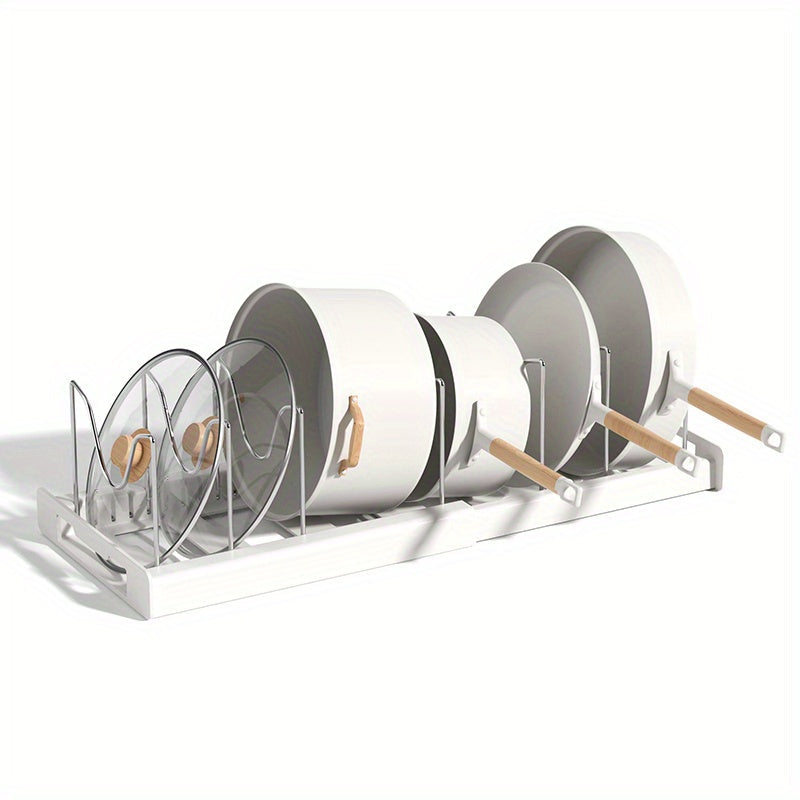 Retractable pot rack for kitchen storage, built into the cabinet under the sink. This adjustable rack is designed to store pots, pans, and lids, making it a convenient kitchen accessory.