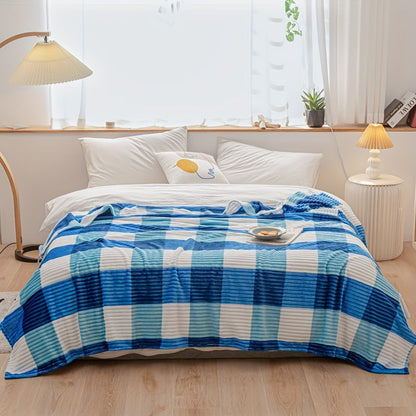 A cozy fleece blanket with whimsical stripes, ideal for snuggling up at work or having a quick snooze.