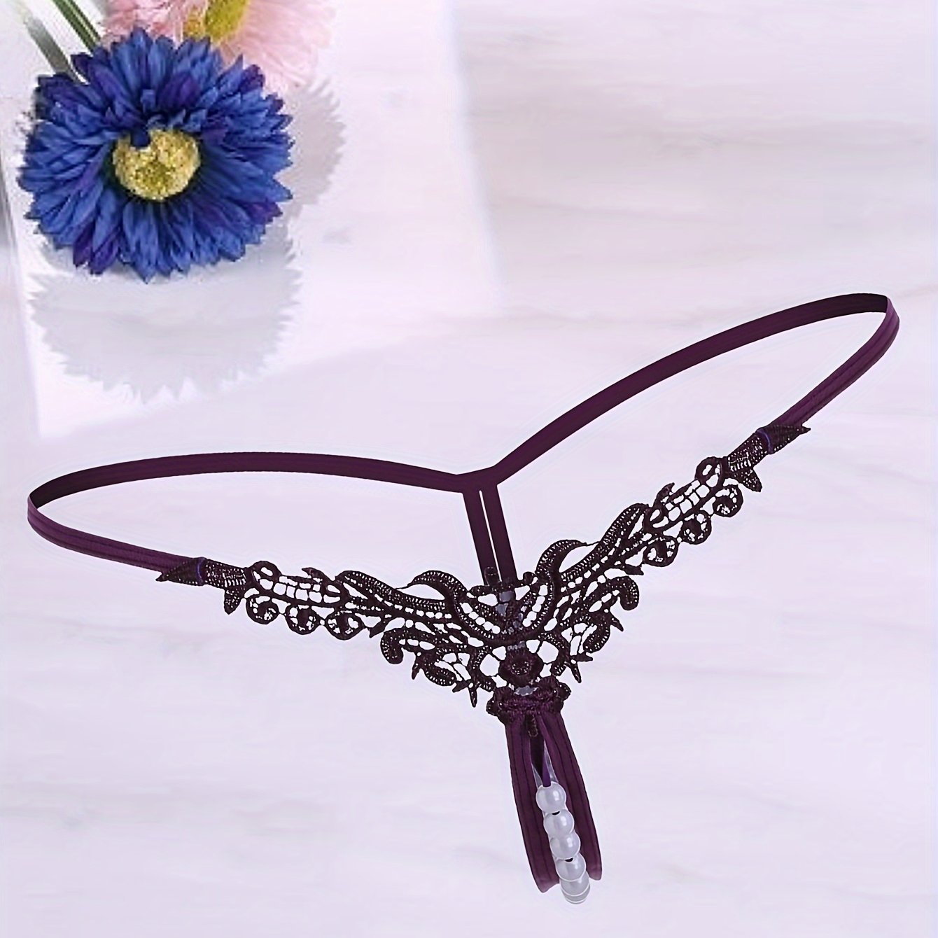 Women's low-rise thong with faux pearl design, sexy lingerie & underwear.