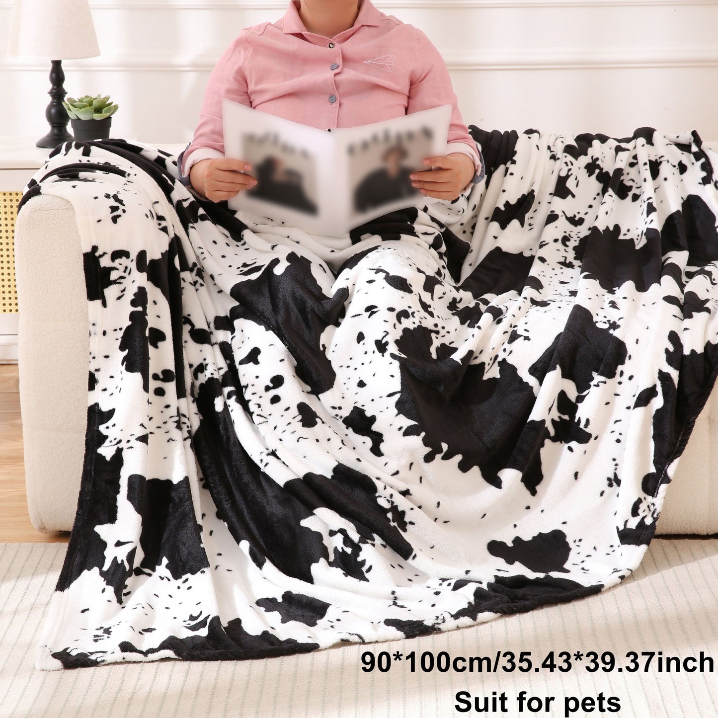 Get cozy with this soft and warm cow print blanket. Perfect for adding a touch of whimsy to your sofa, couch, or bed, this lightweight throw is made from plush flannel fleece. It's a great gift idea for any cow lover and perfect for all seasons.