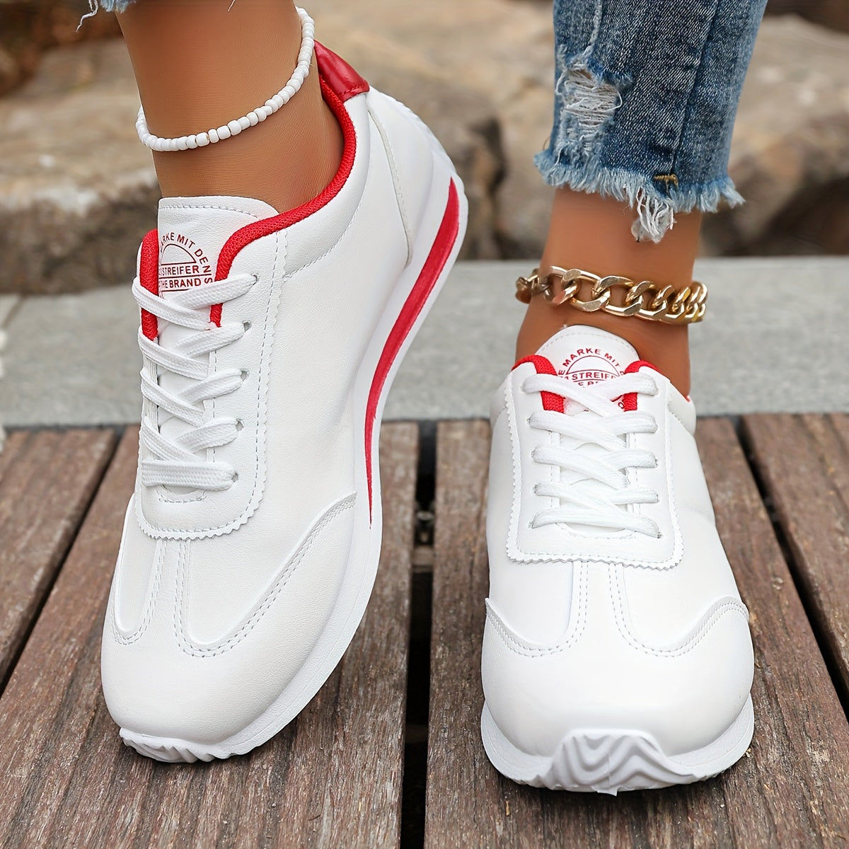 White synthetic leather women's casual sneakers with stability support, all-season comfort, and breathable fabric lining. Perfect for casual attire.