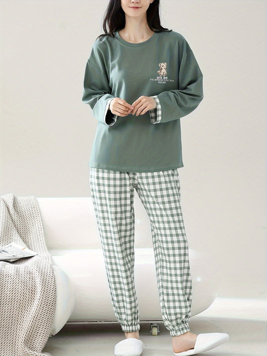 Casual cotton pajama set with cartoon print top and checkered pants for cozy lounging in spring/fall.