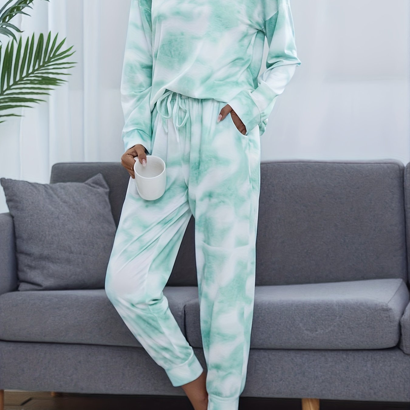 Tie dye lounge set for women, with long sleeve top and elastic waistband pants.