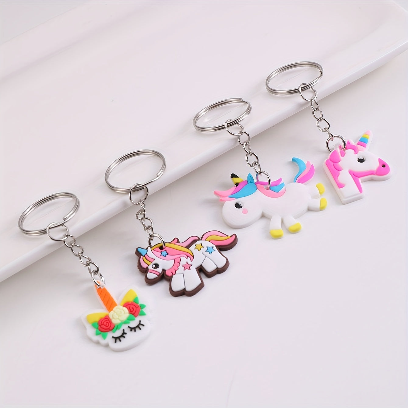 26 DIY cartoon unicorn keychains made of PVC material, perfect for adding a touch of whimsy to your lady's bag or keyring. Ideal for birthday gifts and featuring an adorable animal theme.