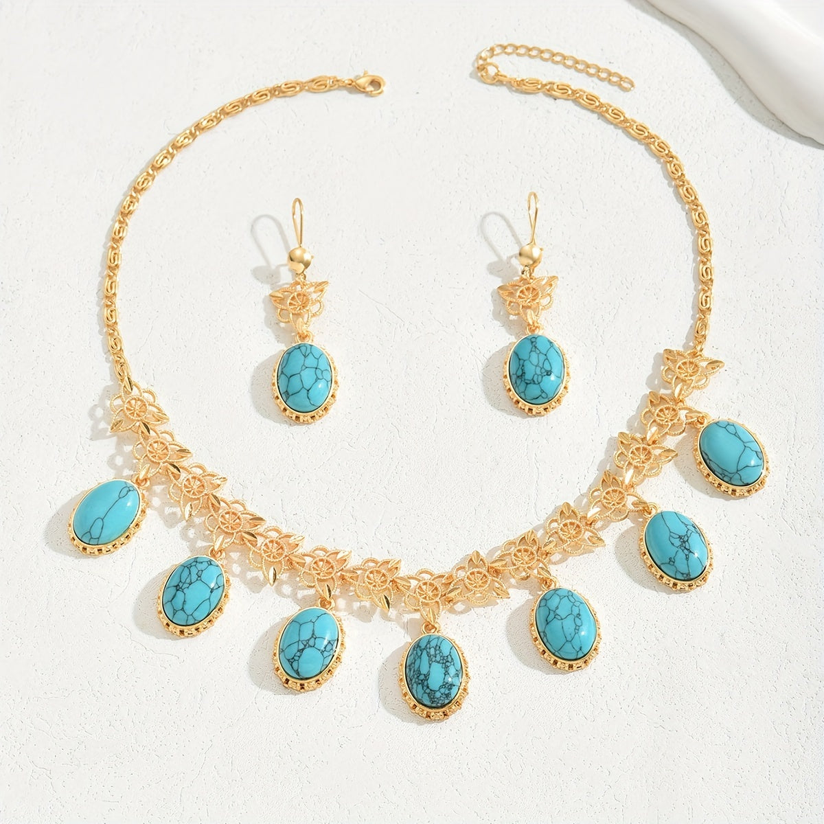 Luxurious and versatile evening dress jewelry set in a three-piece Middle Eastern New Style. Featuring multi-pendant stone hollow earrings and necklace, this exaggerated fashion set exudes high-end luxury. The retro bohemian ethnic style adds a unique