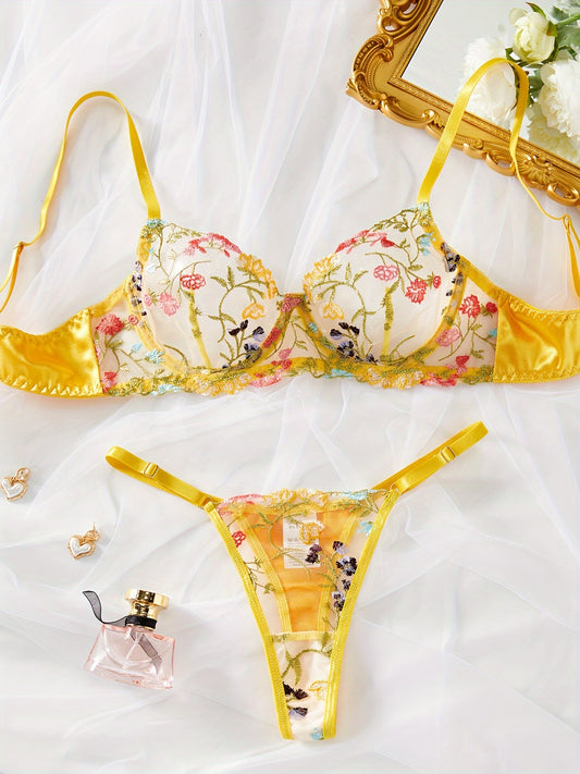 Yellow semi-sheer mesh lingerie set with floral embroidery, including bra and thong. Perfect for a stylish and sexy look.